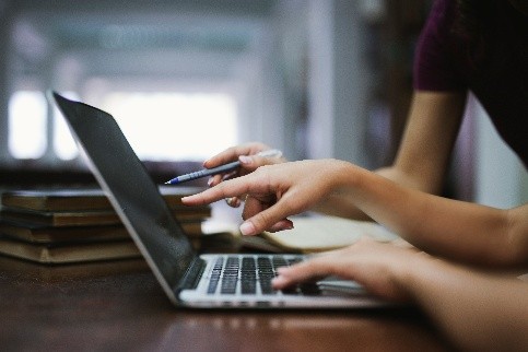 hands typing on keyboard