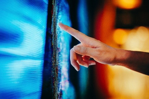 finger pointing to a board